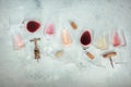 Rose, red, and white wine glasses, with corkscrews and corks, overhead flat lay Royalty Free Stock Photo