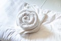 Rose Shape Towel decoration on the Clean White Bed Royalty Free Stock Photo