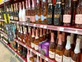 The Rose Sparkling Wine aisle of a Whole Foods Market grocery store with a variety of wines from various vineyards