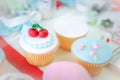 Rose and strawberry fondant cupcakes.