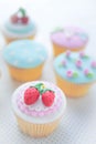 Rose and strawberry fondant cupcakes.