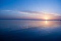 Rose sunrise on the ocean. Sun under the red sea in the morning. Sunset and reflex on water in the evening. Sunrise and blue sky Royalty Free Stock Photo
