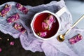 Rose tea with candy made of natural flowers and peanuts