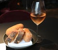 Rose wine and artisian bread served in gourmet restaurant Royalty Free Stock Photo