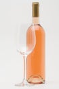 Rose wine bottle with empty glass Royalty Free Stock Photo