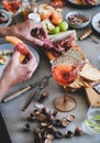 Rose wine, cheese, charcuterie, appetizers and mans hands with food Royalty Free Stock Photo