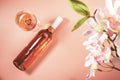 Rose wine glass with bottle on blush background and pink flowers. Rosado, rosato pink wine tasting Royalty Free Stock Photo