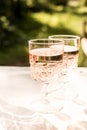 Rose wine in glass. Prosecco. Two glass of wine on bokeh background.