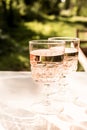 Rose wine in glass. Prosecco. Two glass of wine on bokeh background