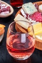 Rose wine with ham and cheese. Spanish tapas in a bar. Food sharing Royalty Free Stock Photo