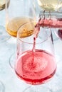 Rose wine pour at a tasting. Winetasting event. Elegant wineglass