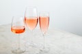 Rose wine summer drinks at wine tasting. Group glasses of pink wine on gray background. Rose wine variety minimal layout Royalty Free Stock Photo