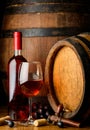 Rose wine on wooden barrel background Royalty Free Stock Photo