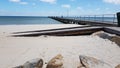 Sand beach and pier Royalty Free Stock Photo