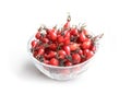 Rosehip berries in a glass bowl on a light background Royalty Free Stock Photo