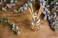 Rosemary air refreshing oil in a bottle with flowers