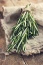 Rosemary bunch on a rustic background