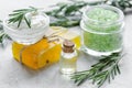 Rosemary essential oil in glass bottle in cosmetic set on table background Royalty Free Stock Photo