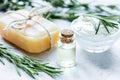 Rosemary essential oil in glass bottle in cosmetic set on table background Royalty Free Stock Photo