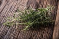 Rosemary. Fresh rosemary herbs. Organic aromatic herbs on wooden table