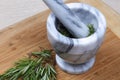 Rosemary herb in a mortar and pestle from above Royalty Free Stock Photo