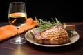 rosemary marinated pork chops beside a glass of saison