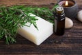 Rosemary soap and essential oil aromatherapy with candle on wood Royalty Free Stock Photo