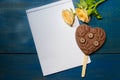 Roses and chocolate heart on the crustica wood with place for text