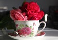 Roses in a cup of coffee