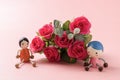 Roses and doll Royalty Free Stock Photo