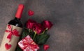 Roses, gifts and bottle of red wine, concept for Valentines Day, Top view, Space for text