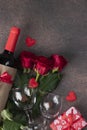 Roses, gifts, bottle of red wine and two glasses, a concept for Valentines Day, Top view