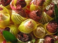 Roses with glitter in a bouquet. yellow mesh wrapped rose buds