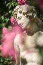 Roses and gods statue in the rose garden Beutig in Baden-Baden Royalty Free Stock Photo