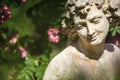 Roses and gods statue in the rose garden Beutig in Baden-Baden Royalty Free Stock Photo