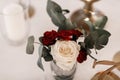 Roses and greenry bouquet table arrangement