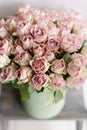 Roses of multicolor, pastel pink and lilac color. Lots of buds. Floral natural backdrop. Flower shop concept