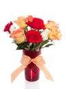Roses in a red glass vase Royalty Free Stock Photo