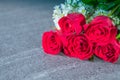 Roses red and white flowers Placed on stone table. Royalty Free Stock Photo