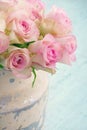 Roses in a shabby chic metal bucket