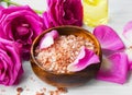 Roses spa setting with bath salt, roses flowers, bath rose oil, Royalty Free Stock Photo