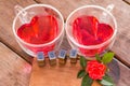 Roses for Valentine , red water in heart cup and love message Royalty Free Stock Photo