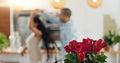 Roses, valentines day and home with couple dancing for love celebration in a kitchen with waltz. Gift, flower present Royalty Free Stock Photo