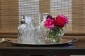 Roses In A Vase. Bamboo curtains in the background Royalty Free Stock Photo