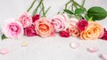 Roses on white marble table, pastel valentines day background