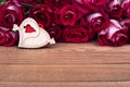 Roses, wooden heart, place for text