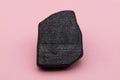 The Rosetta Stone model isolated on pink background Royalty Free Stock Photo