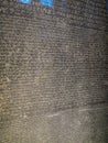 Rosetta stone - written in Egyptian hieroglyphs, Greek and Roman alphabets.