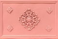 Rosette decoration on an old light pink iron cast door Royalty Free Stock Photo