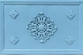 Rosette decoration on an old light blue iron cast door Royalty Free Stock Photo